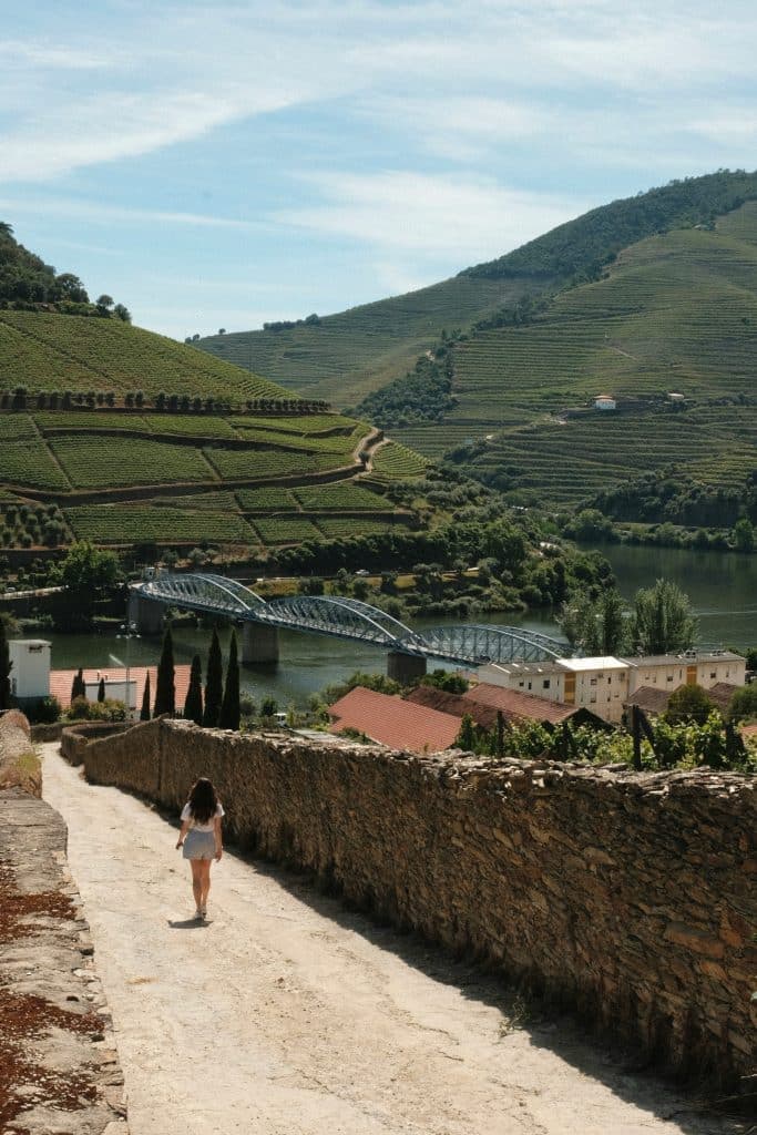 Girl walking on a bridge in Douro, Portugal